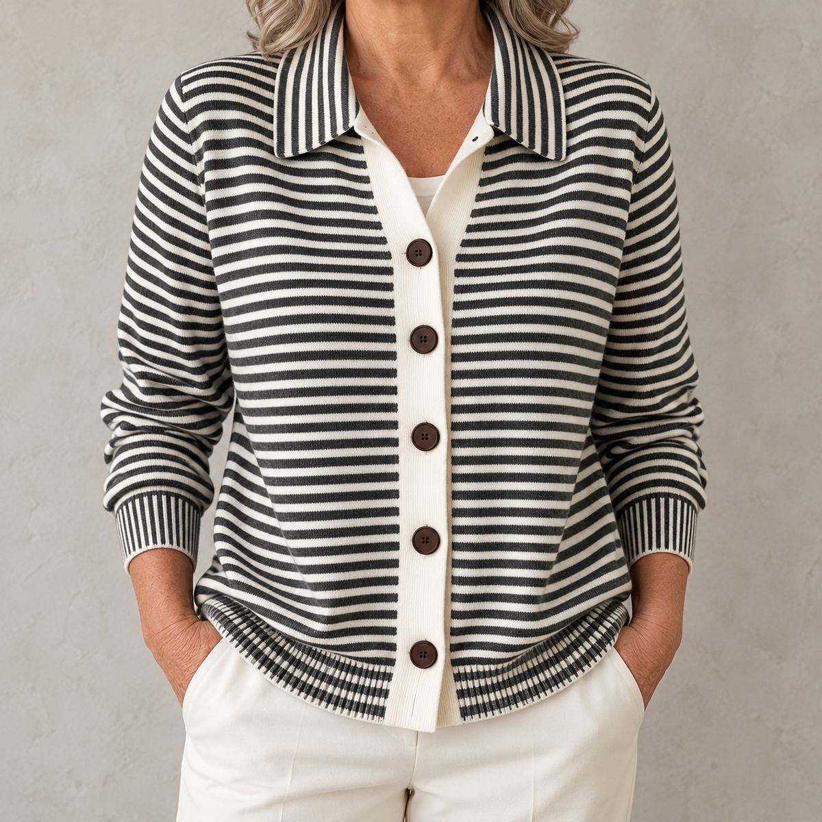 Nola striped button cardigan in Black on a warm gray background